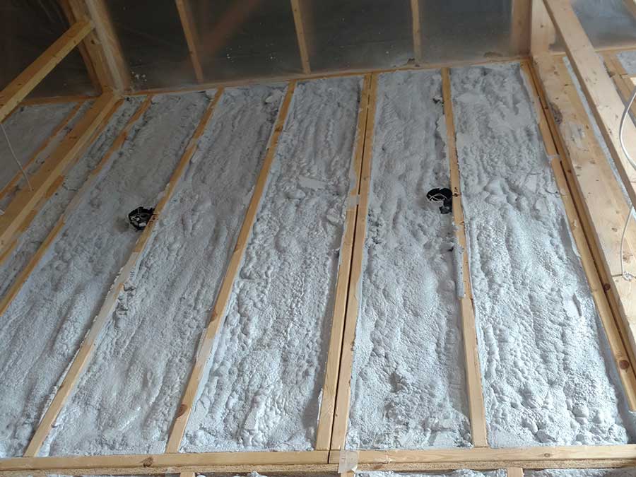 Freshly installed loose fill insulation in wall cavities