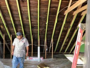 Attic insulation prep work in progress with protective plastic